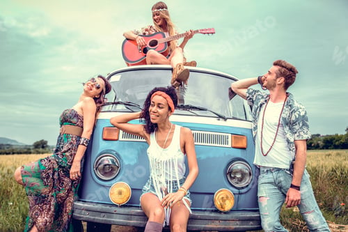 Preview: Happy friends driving a vintage minivan