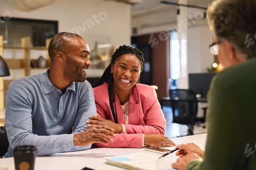 Preview: Black mid adult couple meeting financial advisor for investment