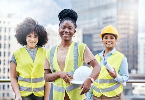 Preview: Portrait of a group of confident young businesswomen working at a construction site