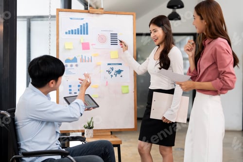 Preview: A diverse team of young professionals collaborating on a new business project in a modern office