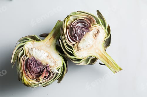 Preview: Artichoke, on white table. top view