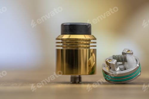 Preview: Closeup shot of a rebuildable dripping atomizer for vaping with blurred background