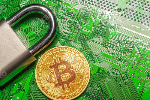 Bitcoin Security Concept with Padlock on Circuit Board