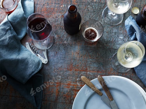 Preview: Wine and dine scene with drinks and rustic tableware.