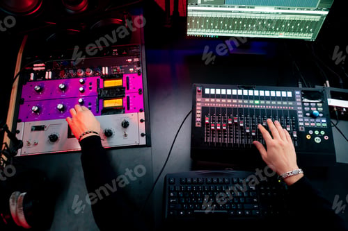 Preview: top shot the recording room dark with neon lighting in the studio the sound engineer works with the