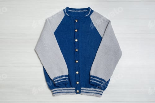 Preview: Knitted children's sweater on a white background