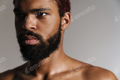 Preview: Black shirtless bearded man posing and looking aside