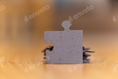 Preview: Selective focus shot of a puzzle piece with space for text