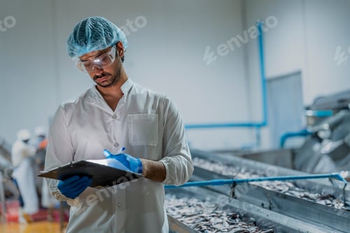 Preview: scientist Worker inspecting fish seafood processing equipment