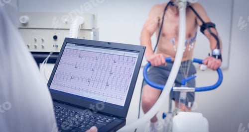Preview: Man Doing Fitness Test On Exercise Bike At The Medical Centre