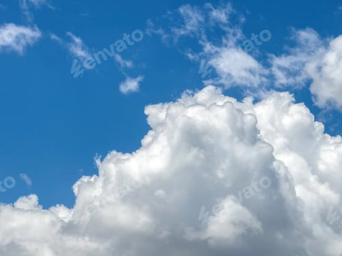 Preview: Blue sky with clouds background, sunny day. White and grey fluffy cloudscape