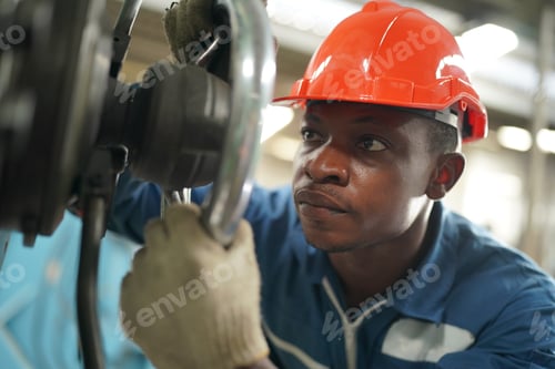 Preview: Factory Engineer Operating machines in industry factory.