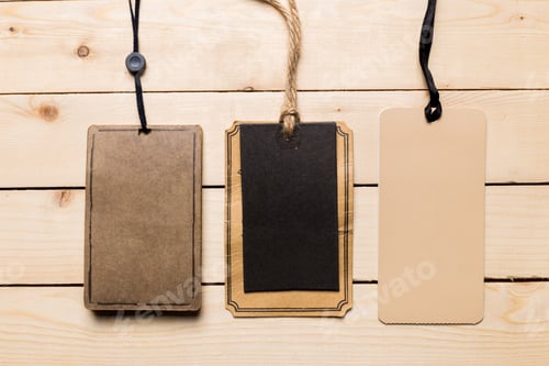 Preview: Blank tags on wooden surface for labeling and organizing various items