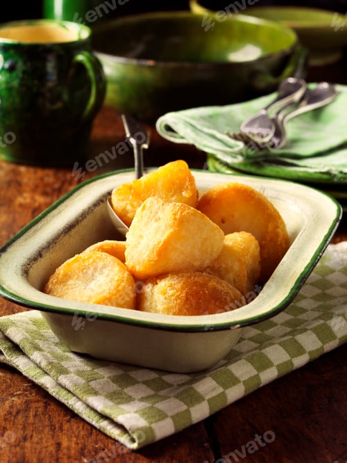 Preview: Golden roast potatoes in vintage dish, wooden table