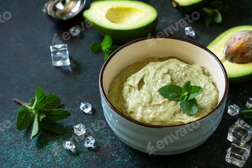 Preview: Homemade avocado fruit ice cream, summer tropical fruit sorbet on a stone table.