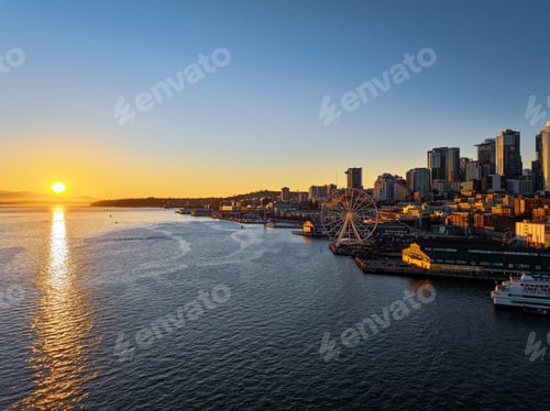 Preview: Stunning view of Seattle at sunset with city skyline by the golden light reflected on water