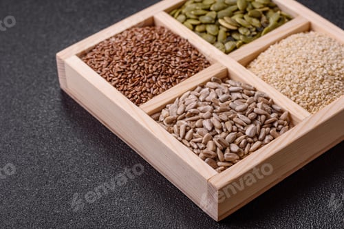 Preview: Sunflower, pumpkin, flax and sesame seeds in a wooden box