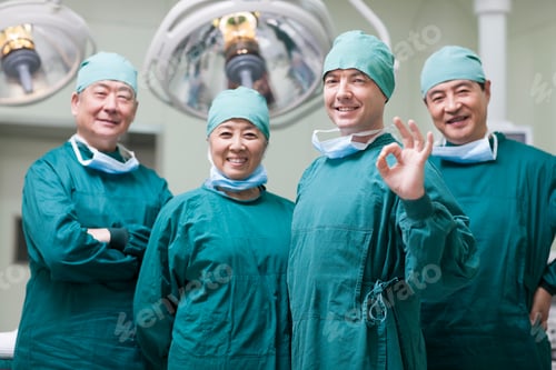 Preview: Smiling Medical Team in Surgery Room Setting