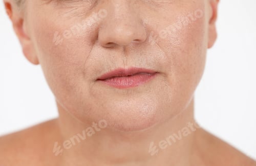 Preview: Beautiful older woman on white background, closeup of lips