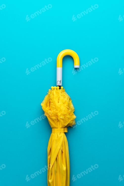 Preview: Folded Yellow Umbrella on Turquoise Blue Background