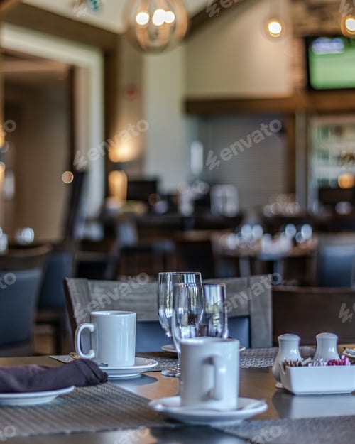 Preview: Vertical shot of neat tables in a nice, empty and clean restaurant