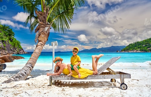 Preview: Family On Beautiful Petite Anse Beach, Mother With Three Year Old Toddler Boy On Sun Bed. Summer
