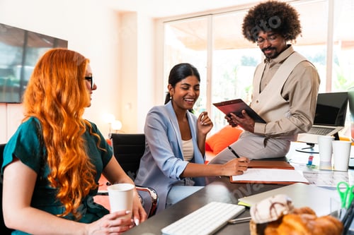 Preview: Multiethnic small group of businesspeople meeting in a coworking company office