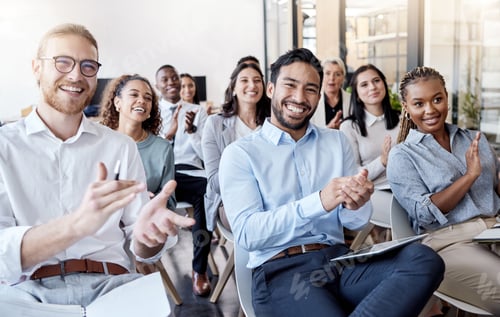 Preview: Shot of a group of businesspeople clapping hands during a conference