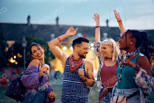 Preview: Happy Friends Dancing at an Outdoor Festival