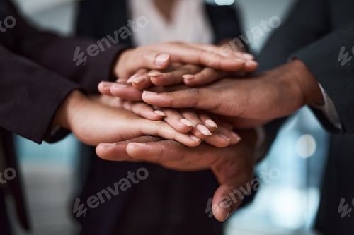 Preview: Cropped shot of a group of unrecognizable businesspeople joining their hands together in a huddle