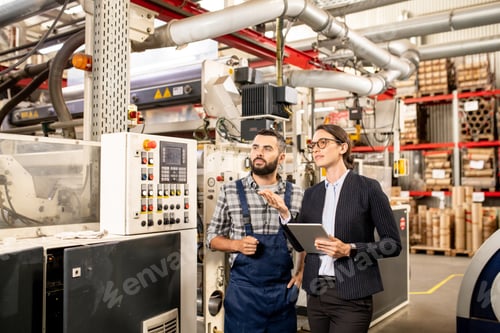 Preview: Two specialists testing and discussing new technology of processing polymers