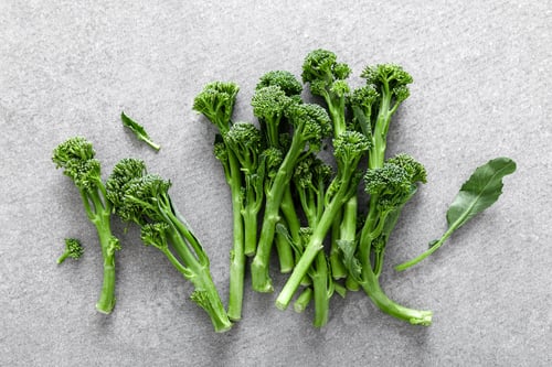 Preview: Broccolini. Fresh bunch of broccoli sprouts on a cooking table. Healthy food concept. Top view