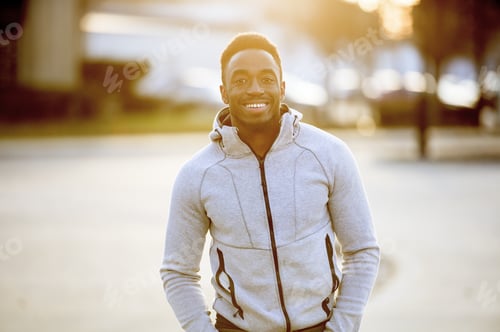 Preview: Shallow focus shot of an attractive African American male smiling at the camera