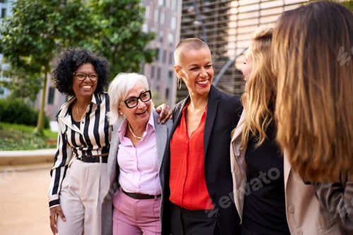 Preview: Group diverse business women colleagues enjoying with each other and laughing at work outside office