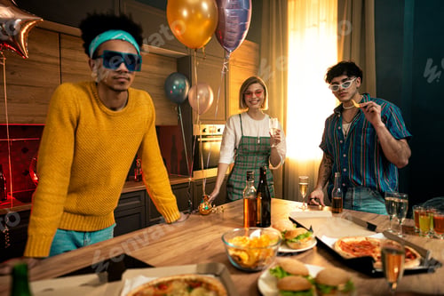 Preview: Group of friends making party at home on new year evening