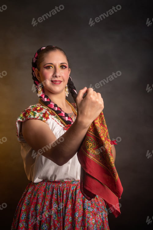 Preview: Mexican woman with Mexican warrior state costume A woman in a colorful skirt is posing for a photo