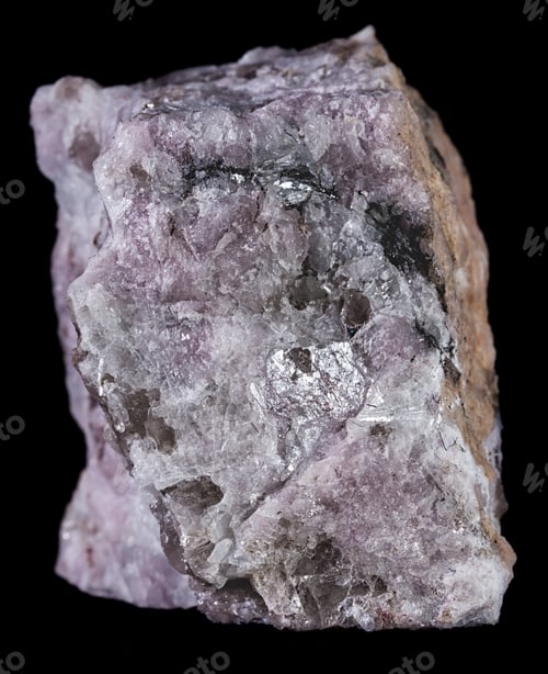 Preview: Vertical shot of a petalite mineral isolated on a black background