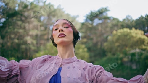 Preview: Fantasy model moving hands standing at green forest pond close up. Sensual woman