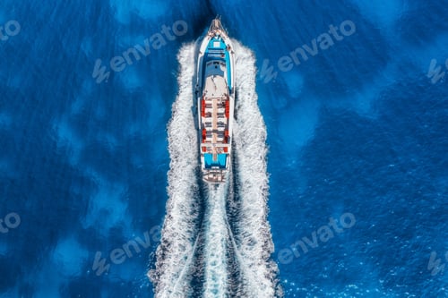 Preview: Aerial view of beautiful floating yacht in blue sea at sunny day