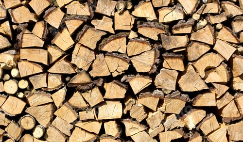 Preview: Background of dry chopped firewood logs in a pile