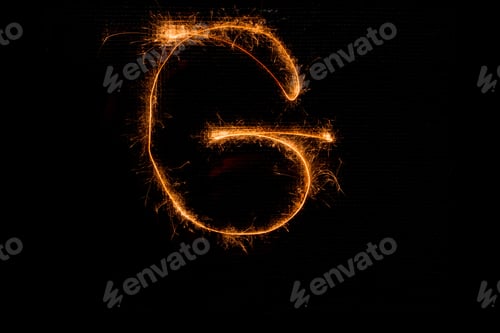 Vista previa: The English Letter G Made Of Sparklers On Black Background