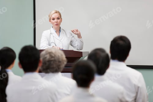 Preview: Female doctor giving speech in boardroom