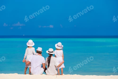 Preview: Young family of four on beach vacation