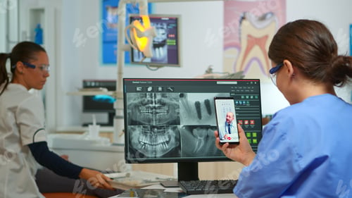 Preview: Nurse having video call with expert stomatologic medic