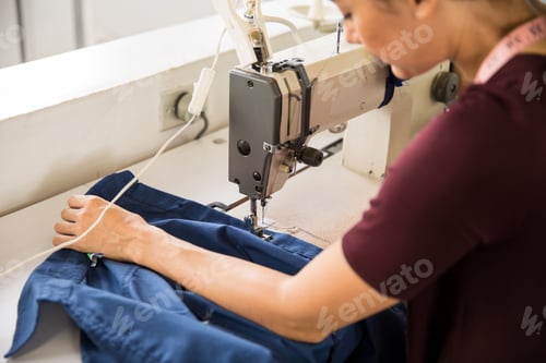 Preview: Female tailor using sewing machine