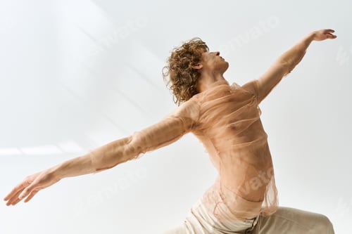 Preview: Curly dancer expressing emotion in a studio with a calming grey backdrop