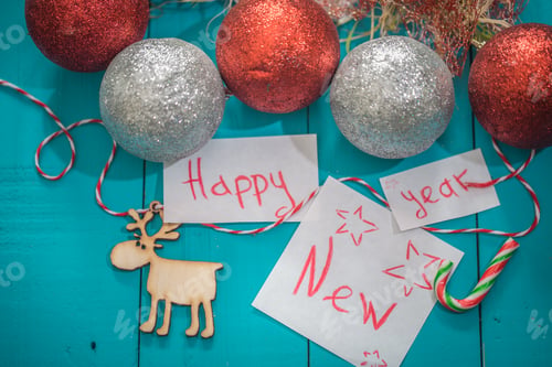 Preview: happy new year inscription on wooden background