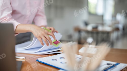 Preview: Businesswoman hands working in Stacks of paper files for searching and checking document achieves
