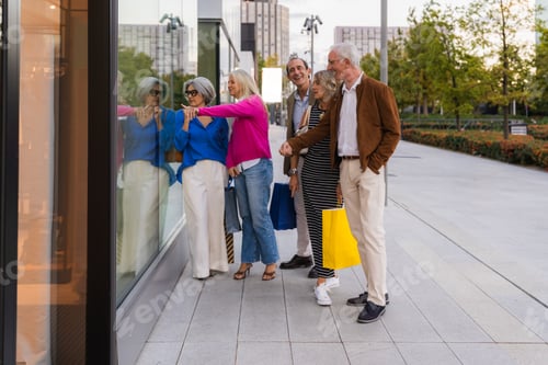 Preview: Mature friends window shopping together in a city