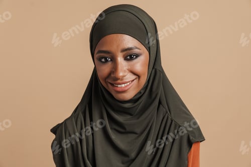 Preview: Young muslim women in hijab smiling and looking at camera